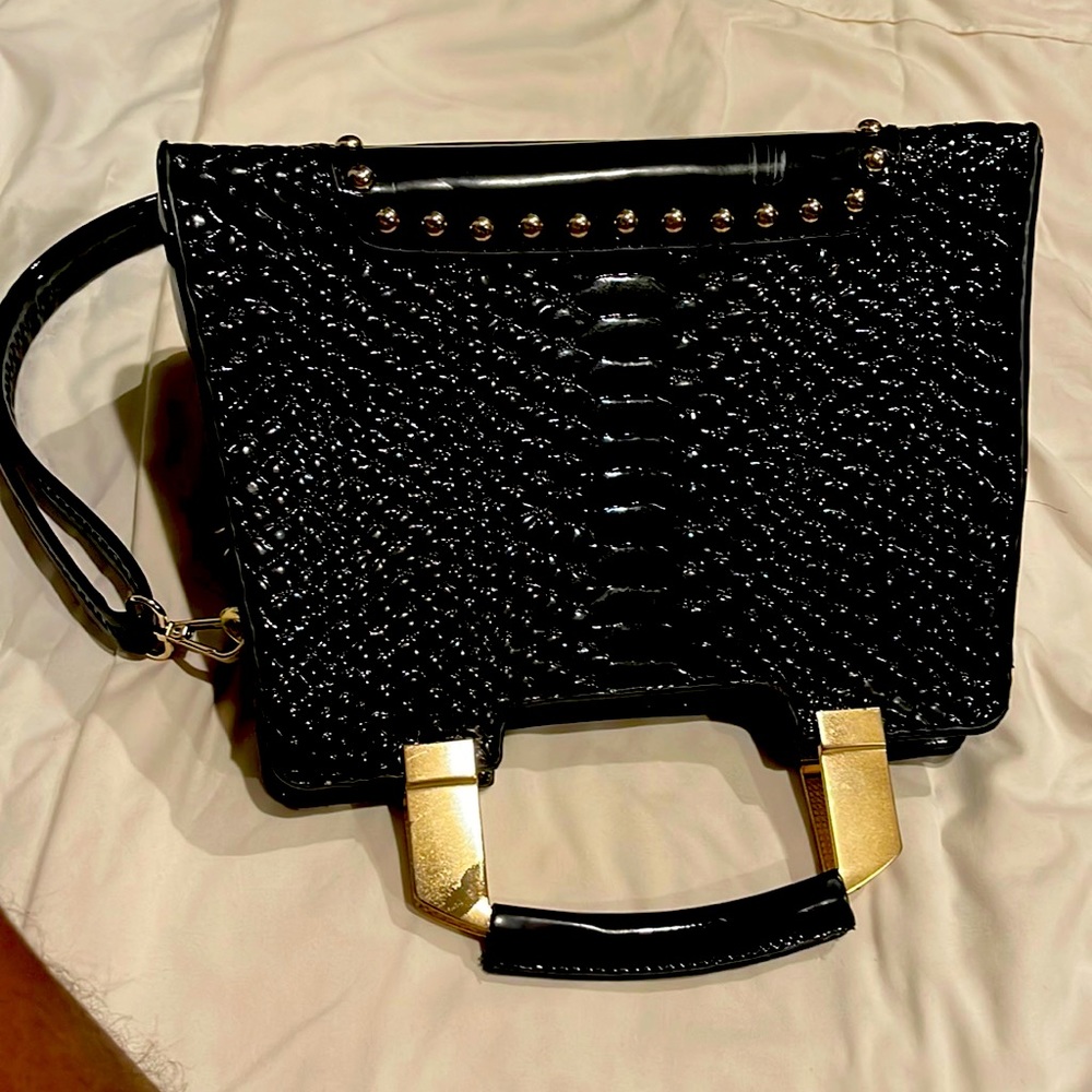 Black lady handbag medium size and none name brand.